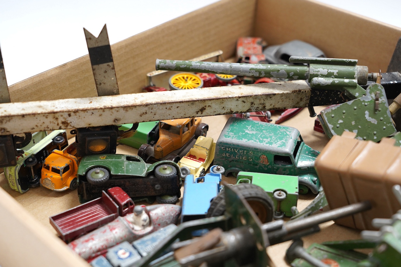 A collection of diecast toys, including an early Britains half-track army troop transporter, Matchbox vehicles, an Astra field gun, etc. Condition - poor